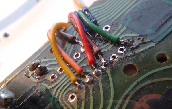 The USB control board wires soldered to matching NES controller pins. Full size